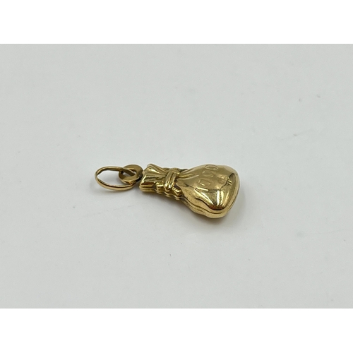 2023 - A 9ct gold money bag pendant - approx. gross weight 0.95g