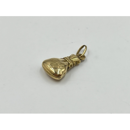 2023 - A 9ct gold money bag pendant - approx. gross weight 0.95g