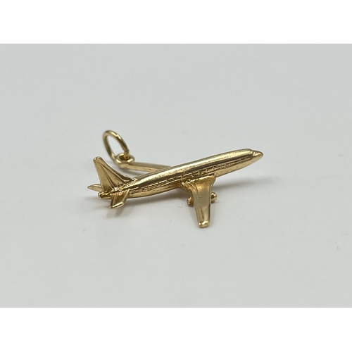 2027 - A hallmarked Birmingham 9ct gold aeroplane pendant - approx. gross weight 2.8g