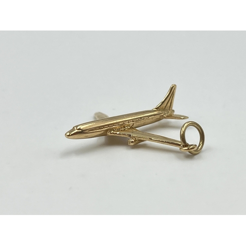 2027 - A hallmarked Birmingham 9ct gold aeroplane pendant - approx. gross weight 2.8g