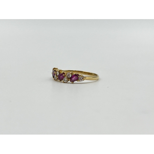 2031 - A 9ct gold ruby and CZ dress ring, size L - approx. gross weight 1.4g