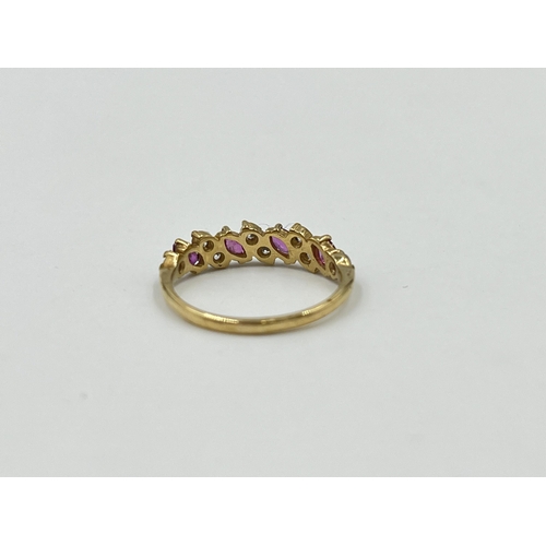 2031 - A 9ct gold ruby and CZ dress ring, size L - approx. gross weight 1.4g