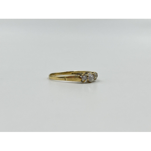 2032 - A hallmarked Birmingham 9ct gold CZ trilogy ring, size R - approx. gross weight 1.4g