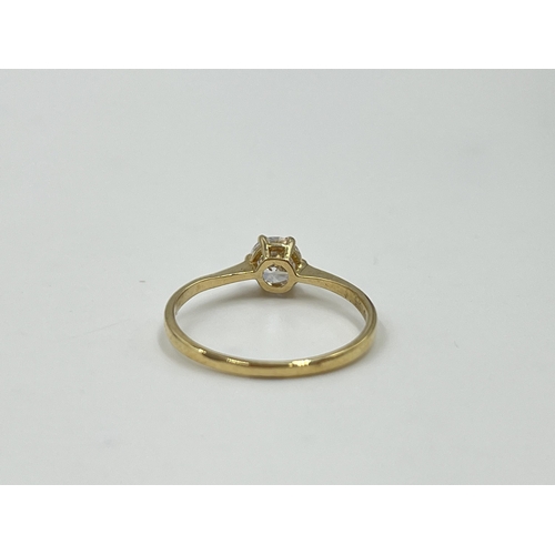 2036 - A 9ct gold CZ solitaire ring, size M½ - approx. gross weight 1.09g