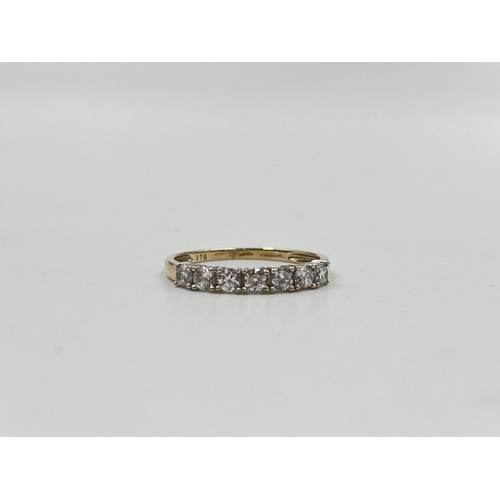 2040 - A 9ct gold CZ seven stone ring, size Q½ - approx. gross weight 1.7g