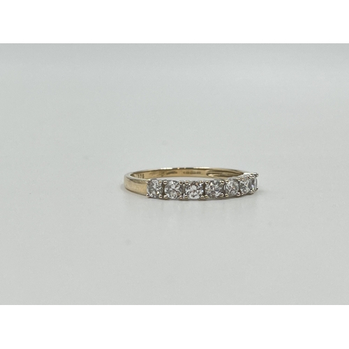 2040 - A 9ct gold CZ seven stone ring, size Q½ - approx. gross weight 1.7g