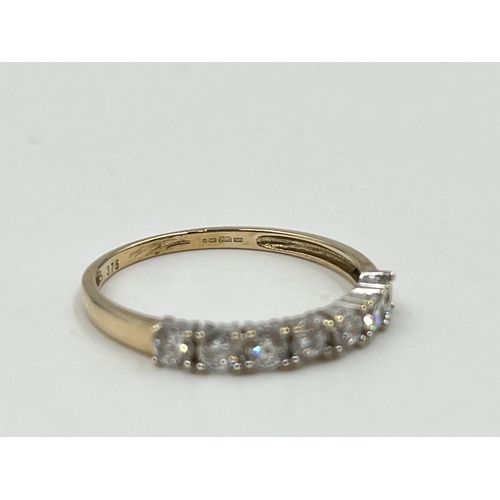 2040 - A 9ct gold CZ seven stone ring, size Q½ - approx. gross weight 1.7g