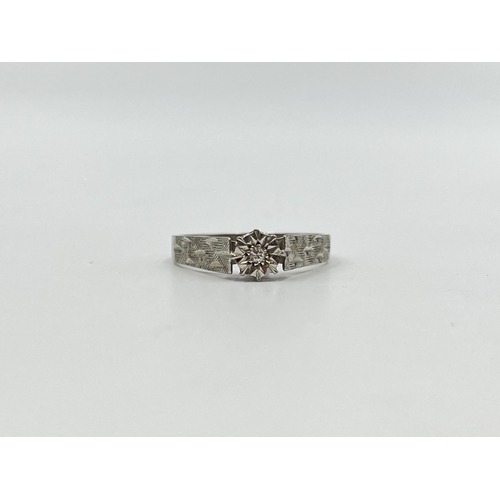 2041 - A hallmarked Birmingham 9ct white gold diamond solitaire ring, size U - approx. gross weight 3g