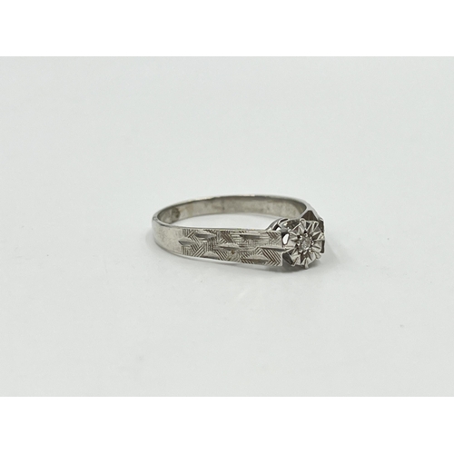 2041 - A hallmarked Birmingham 9ct white gold diamond solitaire ring, size U - approx. gross weight 3g