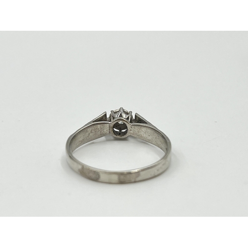 2041 - A hallmarked Birmingham 9ct white gold diamond solitaire ring, size U - approx. gross weight 3g