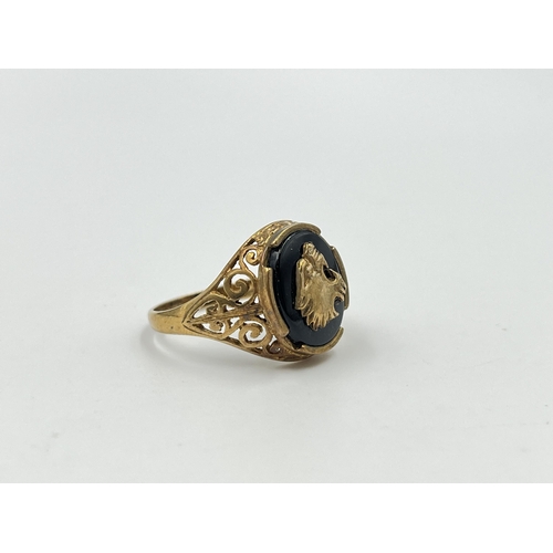 2046 - A hallmarked Birmingham 9ct gold and black onyx pierced Jaguar signet ring, size T - approx. gross w... 