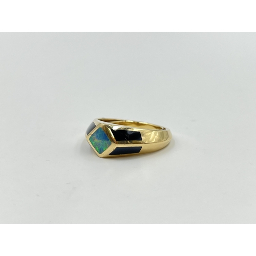 2047 - A 14ct gold black onyx and opal ring, size R - approx. gross weight 9.4g