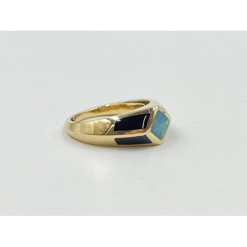 2047 - A 14ct gold black onyx and opal ring, size R - approx. gross weight 9.4g