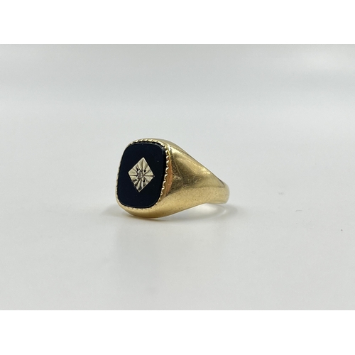 2052 - A hallmarked London 9ct gold black onyx and diamond set signet ring, size O - approx. gross weight 4... 