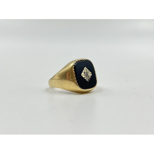 2052 - A hallmarked London 9ct gold black onyx and diamond set signet ring, size O - approx. gross weight 4... 