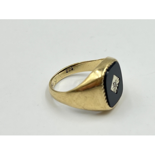 2052 - A hallmarked London 9ct gold black onyx and diamond set signet ring, size O - approx. gross weight 4... 