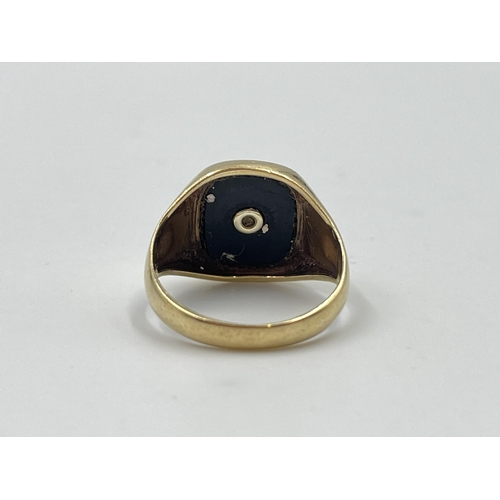 2052 - A hallmarked London 9ct gold black onyx and diamond set signet ring, size O - approx. gross weight 4... 