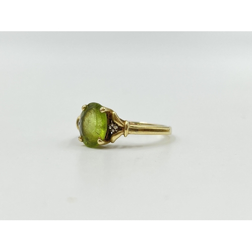 2053 - A 9ct gold peridot and diamond ring, size P½ - approx. gross weight 3g