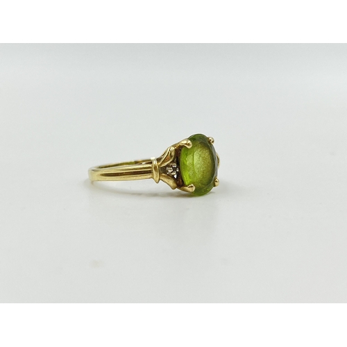 2053 - A 9ct gold peridot and diamond ring, size P½ - approx. gross weight 3g