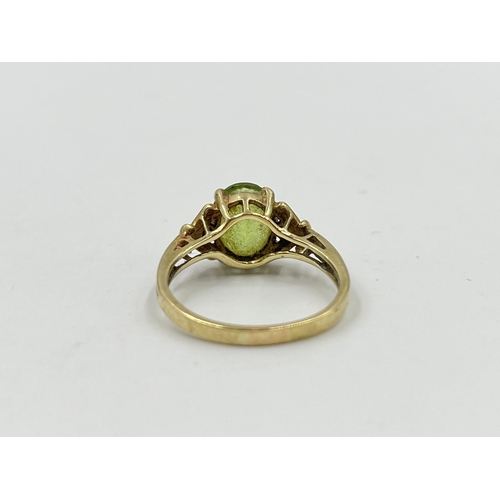 2053 - A 9ct gold peridot and diamond ring, size P½ - approx. gross weight 3g