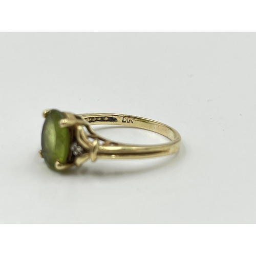 2053 - A 9ct gold peridot and diamond ring, size P½ - approx. gross weight 3g