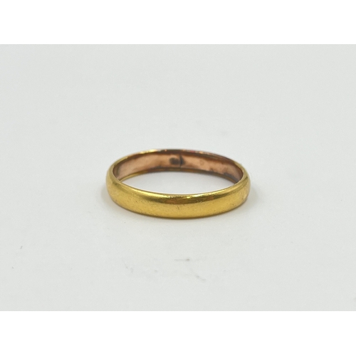 2055 - A yellow metal wedding band, size N½ - approx. gross weight 3.6g