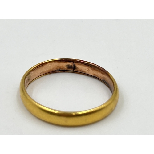 2055 - A yellow metal wedding band, size N½ - approx. gross weight 3.6g