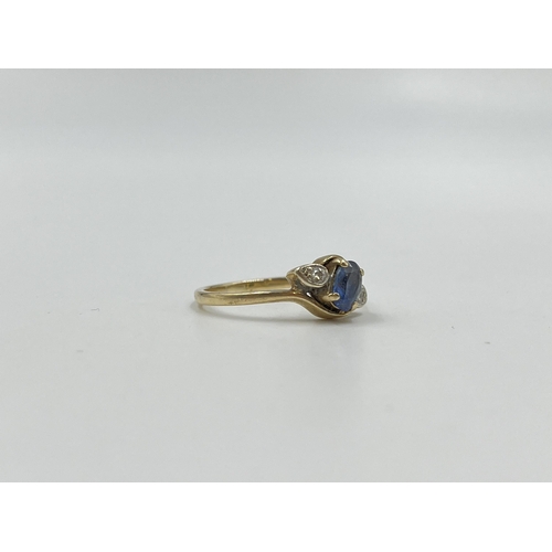 2059 - A hallmarked Birmingham 9ct gold sapphire and diamond bypass ring, size Q - approx. gross weight 2.4... 