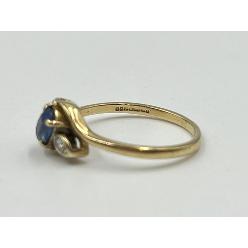 2059 - A hallmarked Birmingham 9ct gold sapphire and diamond bypass ring, size Q - approx. gross weight 2.4... 