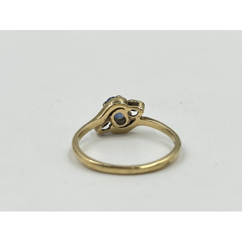 2059 - A hallmarked Birmingham 9ct gold sapphire and diamond bypass ring, size Q - approx. gross weight 2.4... 