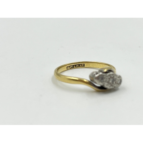 2060 - An 18ct gold and platinum diamond bypass ring, size M - approx. gross weight 2.3g