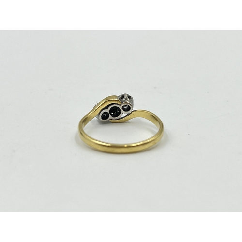 2060 - An 18ct gold and platinum diamond bypass ring, size M - approx. gross weight 2.3g