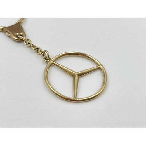 2063 - A hallmarked Birmingham 9ct gold Mercedes key ring - approx. gross weight 9.6g