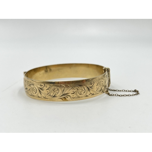 2074 - A vintage H.G & S 9ct rolled gold floral etched bangle - approx. gross weight 28g