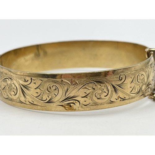 2074 - A vintage H.G & S 9ct rolled gold floral etched bangle - approx. gross weight 28g