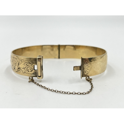 2074 - A vintage H.G & S 9ct rolled gold floral etched bangle - approx. gross weight 28g