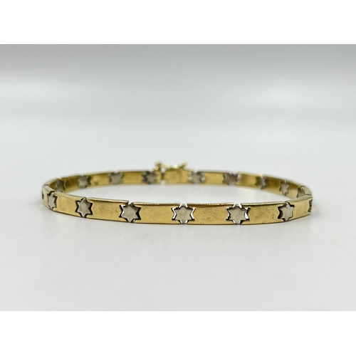 2082 - A stamped 14ct gold star motif bracelet - approx. gross weight 13.4g