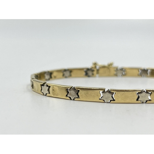 2082 - A stamped 14ct gold star motif bracelet - approx. gross weight 13.4g