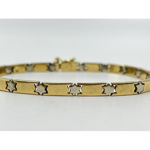 2082 - A stamped 14ct gold star motif bracelet - approx. gross weight 13.4g