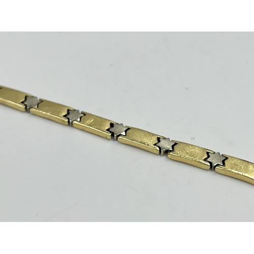 2082 - A stamped 14ct gold star motif bracelet - approx. gross weight 13.4g