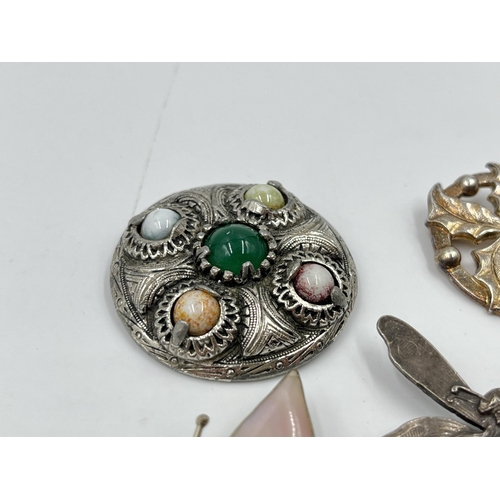 2086 - Five white metal brooches to include Celtic design, enamel etc.