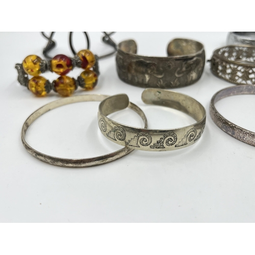 2088 - A collection of white metal bangles and cuff bracelets