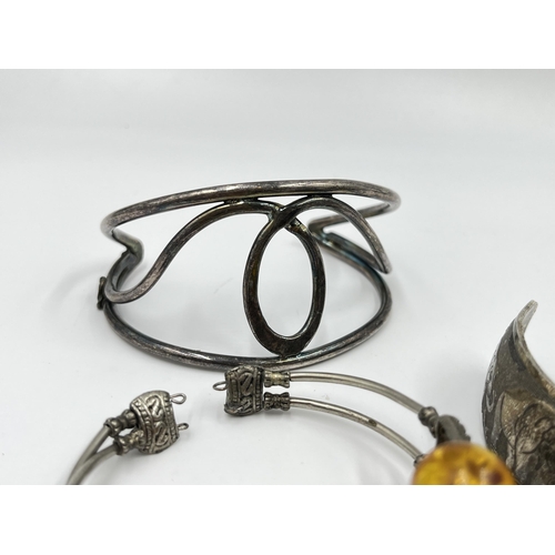 2088 - A collection of white metal bangles and cuff bracelets