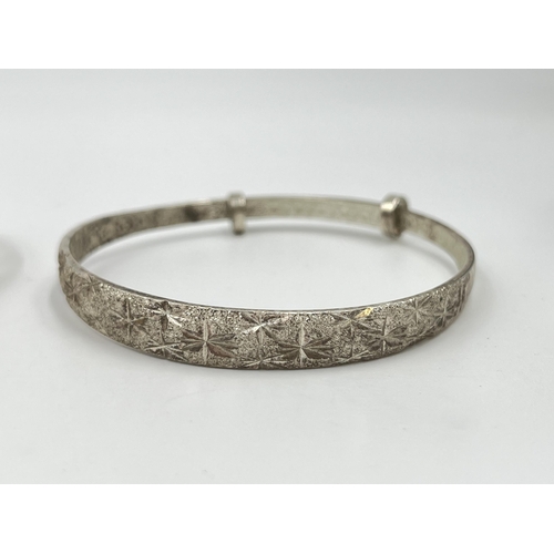 2090 - Four silver bracelets and bangles to include Siam sterling and enamel, lapis lazuli etc. - approx. g... 