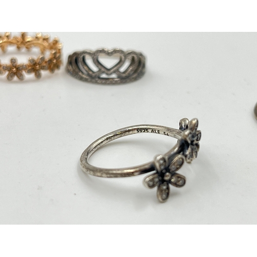 2094 - Five pieces of Pandora .925 silver jewellery, four rings and one pendant necklace - approx. gross we... 