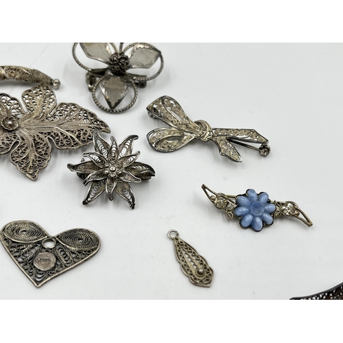 2096 - A collection of silver and white metal filigree jewellery to include .835 bow brooch, .835 leaf broo... 