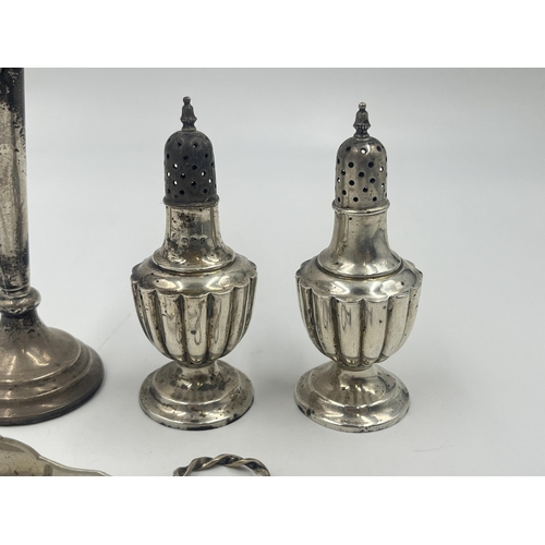 2193 - Four pieces of hallmarked silver, one Scandinavian J.M. .830 spoon, two Chester pepper shakers and o... 