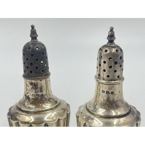 2193 - Four pieces of hallmarked silver, one Scandinavian J.M. .830 spoon, two Chester pepper shakers and o... 