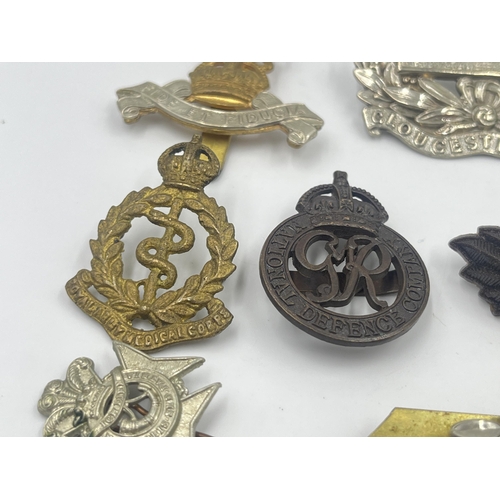 2241 - Ten military cap badges to include Somerset & Cornwall, Gloucestershire, National Defence Company, R... 