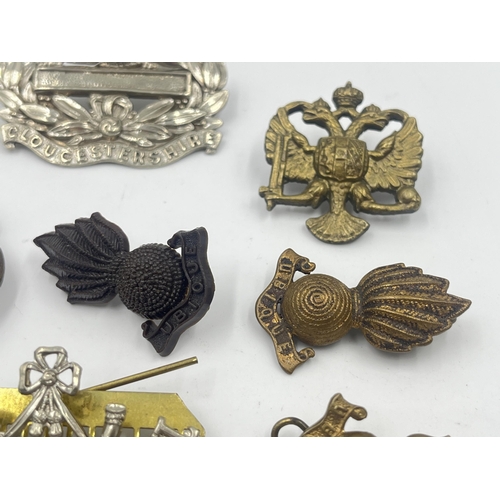 2241 - Ten military cap badges to include Somerset & Cornwall, Gloucestershire, National Defence Company, R... 